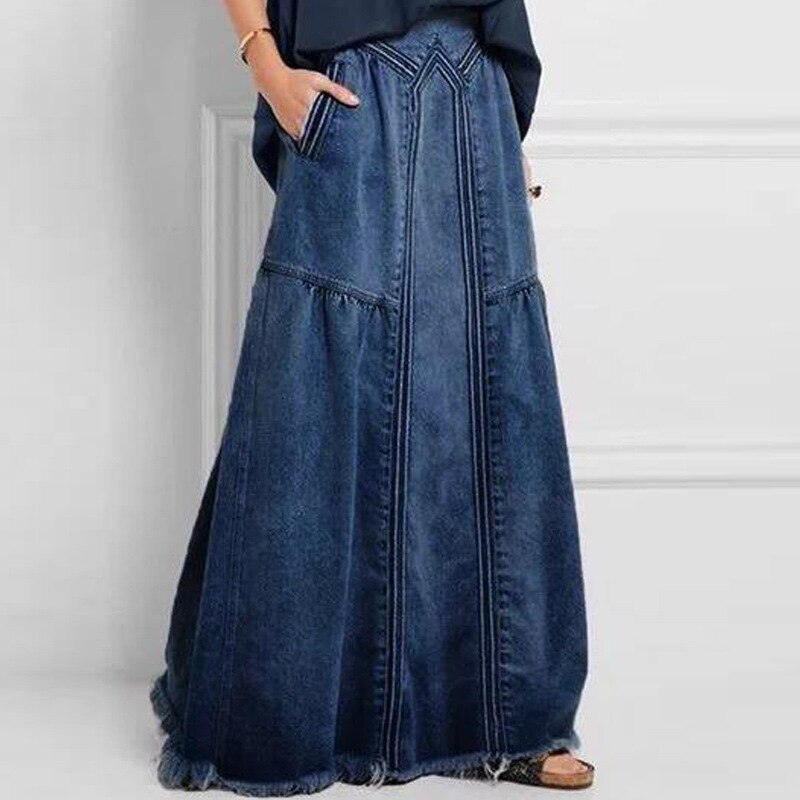 Modna spódnica maxi damska z gumką w pasie, rozkloszowana, z kieszeniami, na styl casual i elegancki.