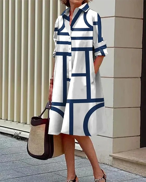 Elegancka damska sukienka midi koszulowa z geometrycznym wzorem i praktycznymi kieszeniami. Modna na co dzień.