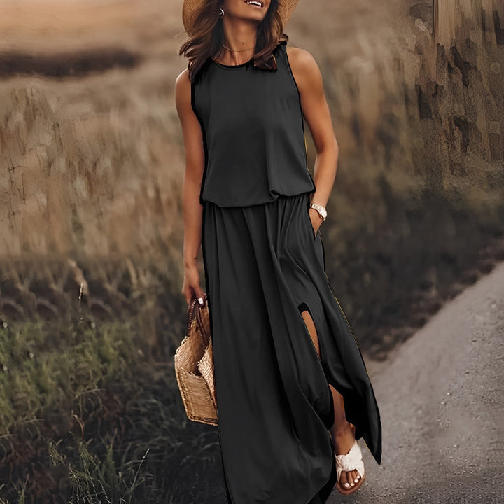 Elegancka damska sukienka maxi bez rękawów z modnym rozcięciem. Idealna letnia kreacja wieczorowa.