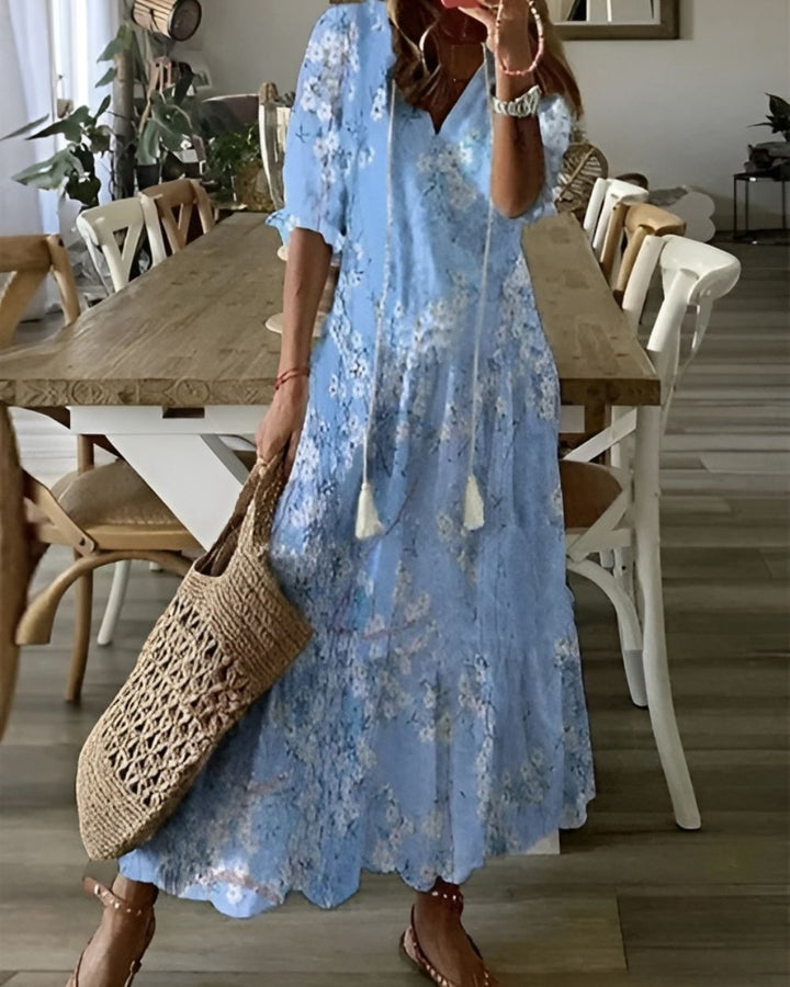 Letnia sukienka damska maxi w stylu boho z barwnym wzorem, lekka i zwiewna, na co dzień.