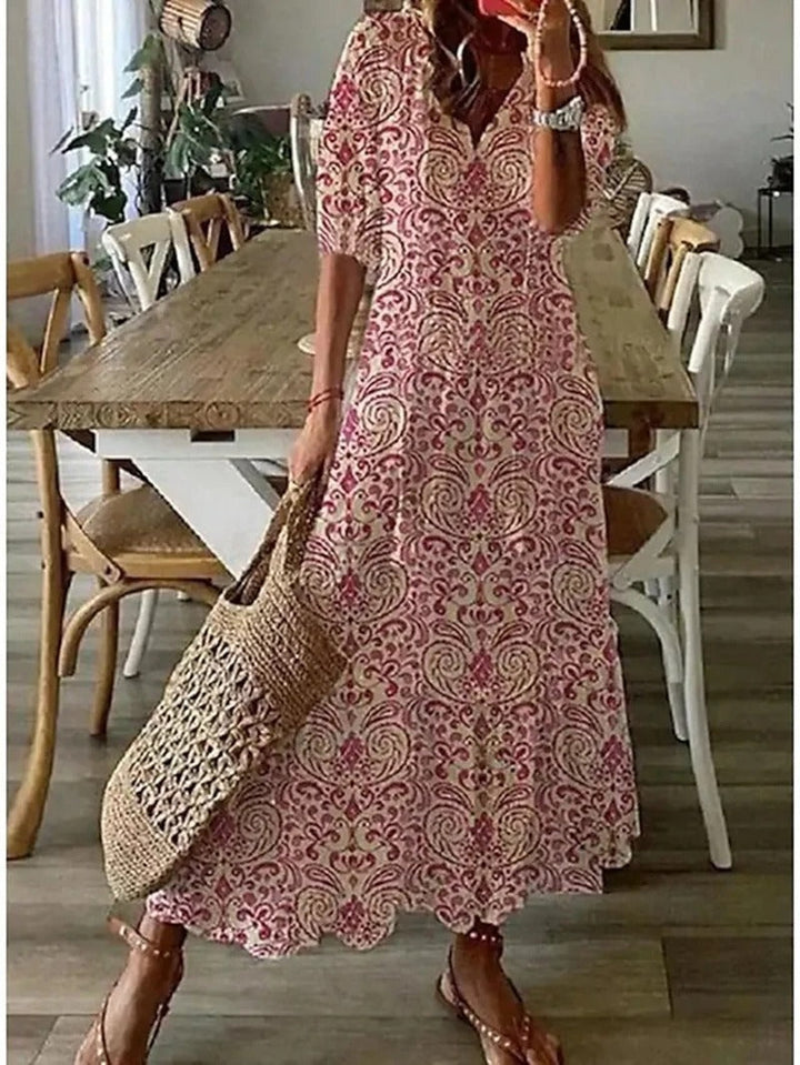 Damska sukienka maxi z dekoltem V i wzorem boho. Lekka, letnia i idealna na upalne dni.