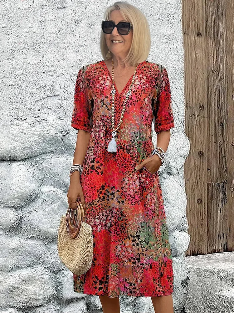 Damska sukienka midi Melina z dekoltem V, idealna na lato i wiosnę. Wygodna, elegancka, polska moda.
