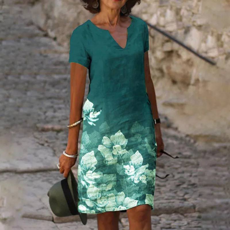 Elegancka sukienka shift midi w kwiaty dla kobiet, z modnym dekoltem V. Wiosenna, casualowa i wygodna.