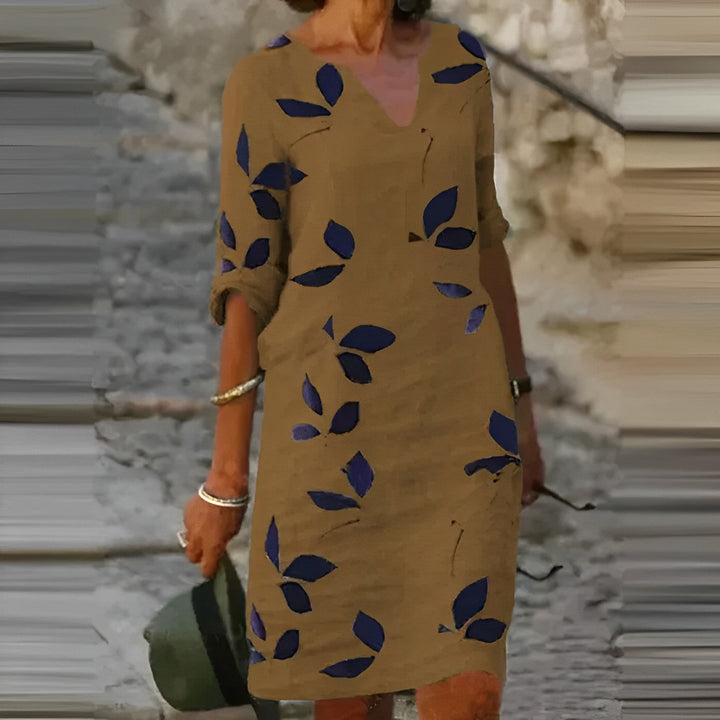 Modna damska sukienka mini z kwiecistym printem, rękawem 3/4 i dekoltem, na lato, casual i elegancka.