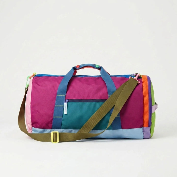 Lekka składana damska torba podróżna i sportowa z modnymi kolorowymi blokami. Wygodna nylonowa duffel bag.