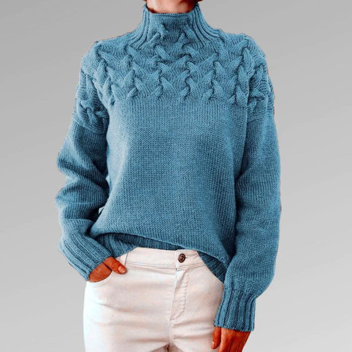 Komfortowy damski sweter oversize z wysokim golfem, doskonały na chłodne dni. Modny styl.