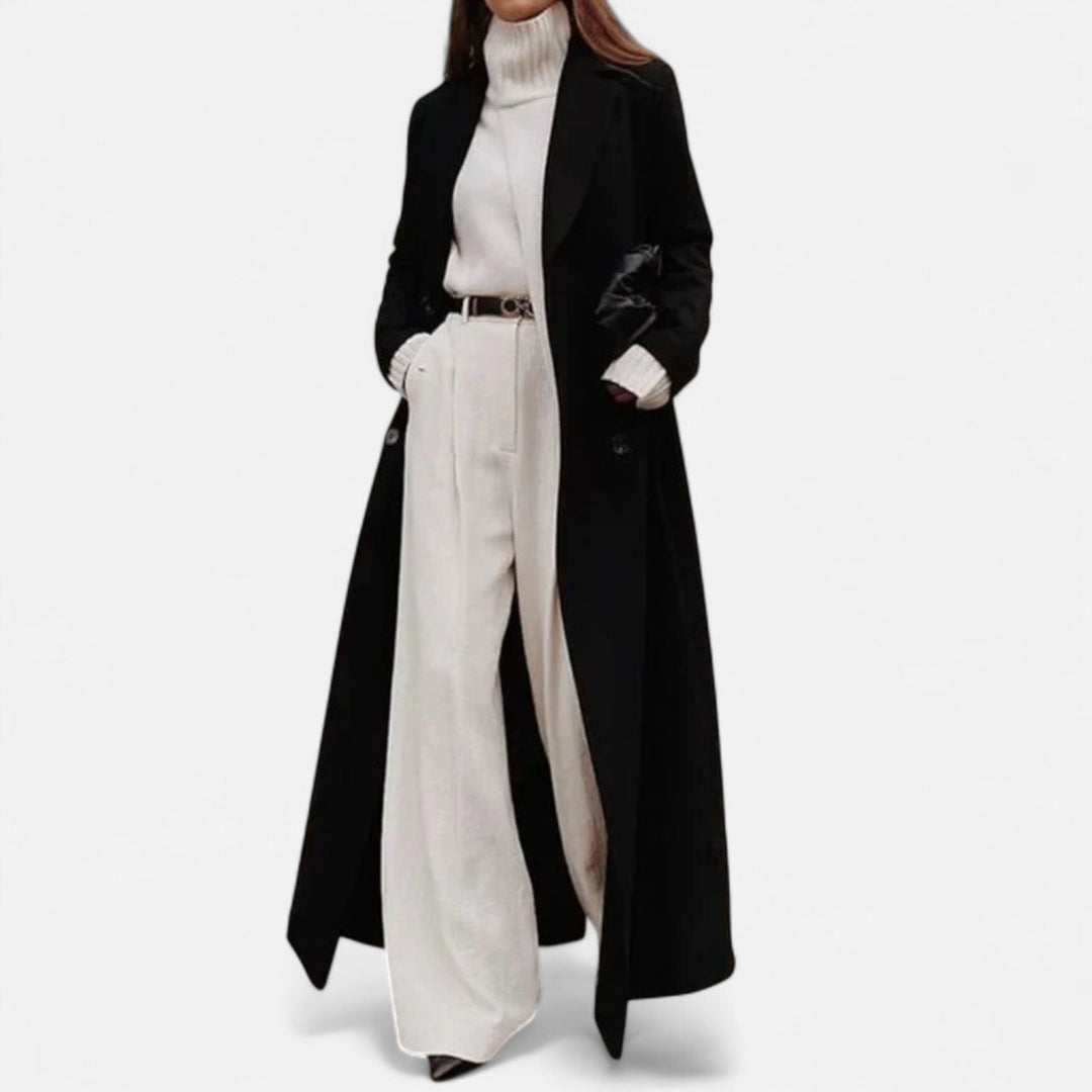 Czarny długi płaszcz damski zimowy. Stylowy maxi płaszcz z guzikami, idealny do eleganckich stylizacji.