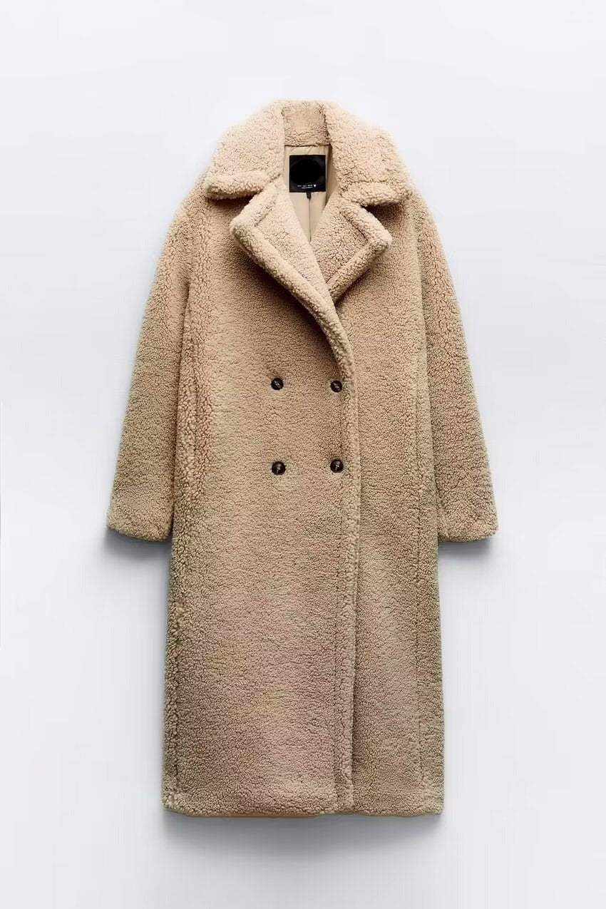 Damski płaszcz z luźnym krojem, dwurzędowy. Modny płaszcz przejściowy, elegancki dodatek do jesiennych outfitów.