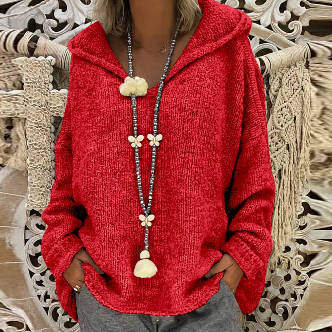 Damski dziergany sweter z kapturem, luźny krój, dekolt V-neck. Komfortowy i casualowy, idealny na jesień.