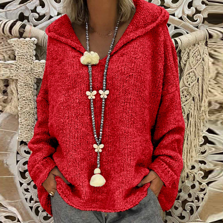 Damski dziergany sweter z kapturem, luźny krój, dekolt V-neck. Komfortowy i casualowy, idealny na jesień.