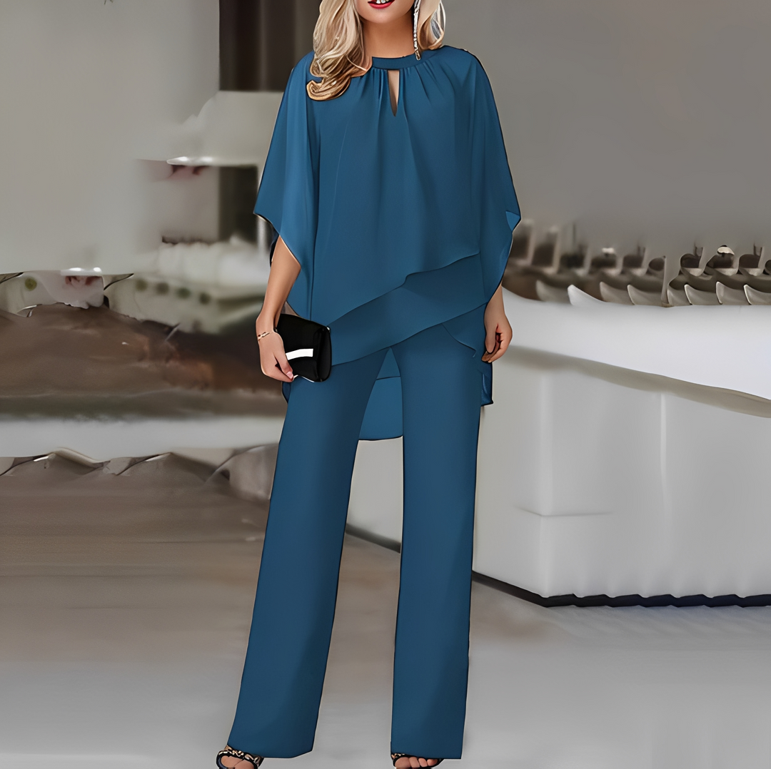 Komfortowy kostium damski z luźnymi spodniami i bluzką. Elegancki, całoroczny styl casual chic.