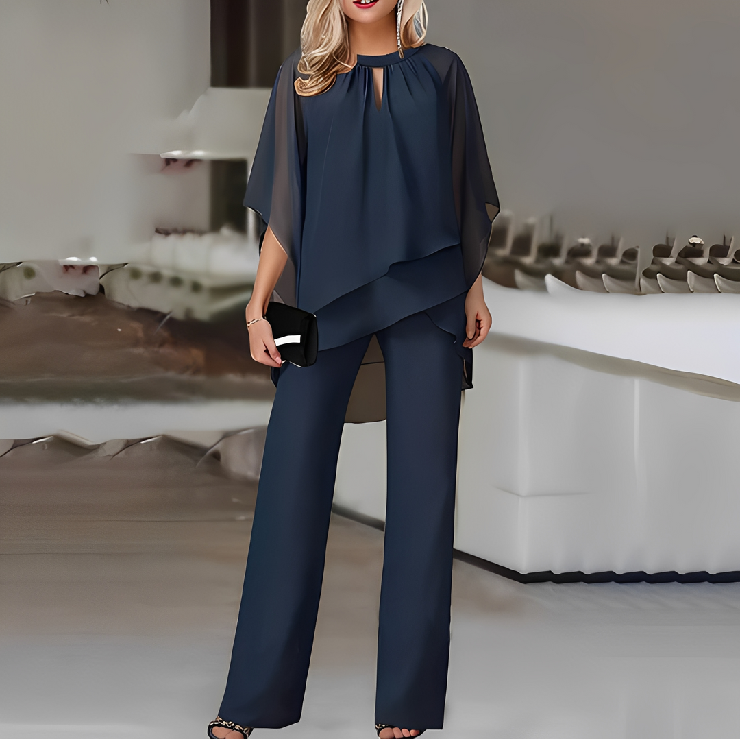 Stylowy komplet damski: bluzka i luźne spodnie. Modne ubranie biurowe oraz na eleganckie wyjścia.