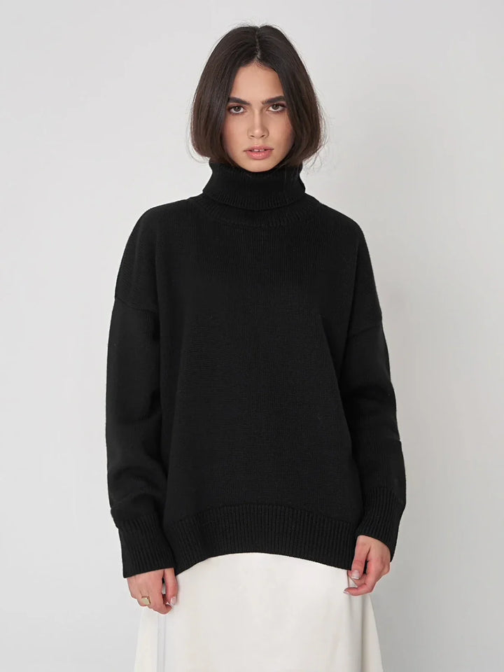 Elegancki zimowy golf damski oversize. Ciepły sweter z wysokim kołnierzem zapewniający komfort.