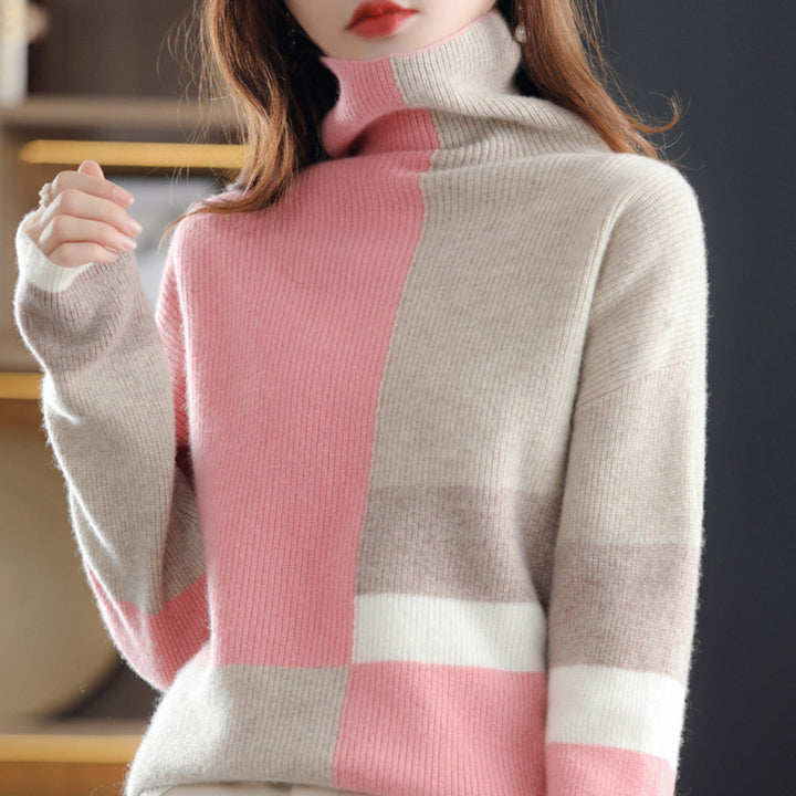 Ciepły sweter damski z golfem i modnym wzorem colorblock. Komfortowy i stylowy na zimowe dni.