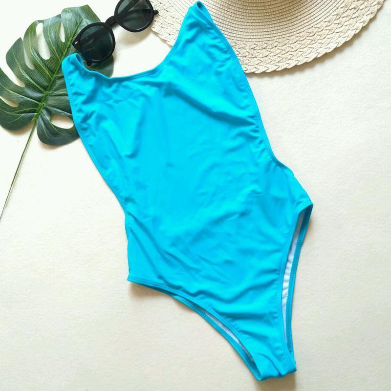 Damski monokini kąpielowy z wycięciami, neonowy, idealny na lato i upalne dni na plaży.