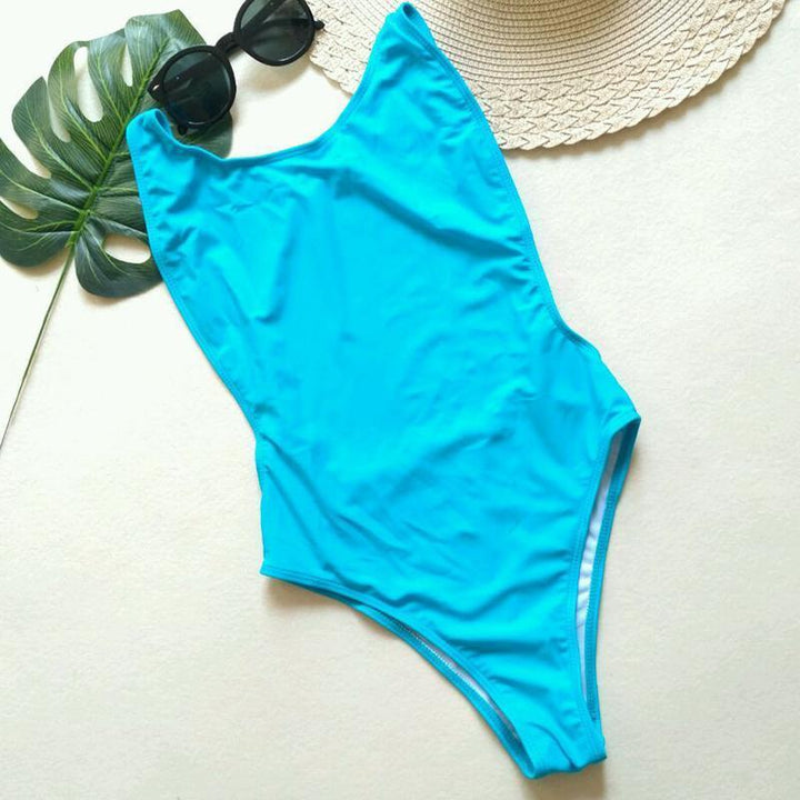 Damski monokini kąpielowy z wycięciami, neonowy, idealny na lato i upalne dni na plaży.