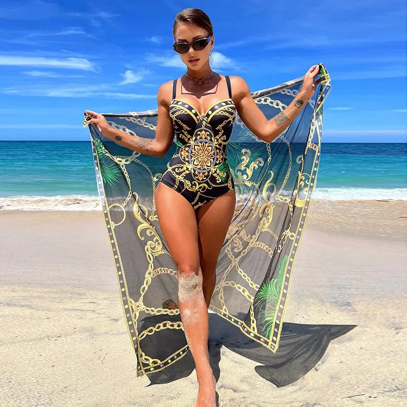 Damski jednoczęściowy strój kąpielowy z eleganckim pareo. Klasyczny czarny fason na plażę i basen.