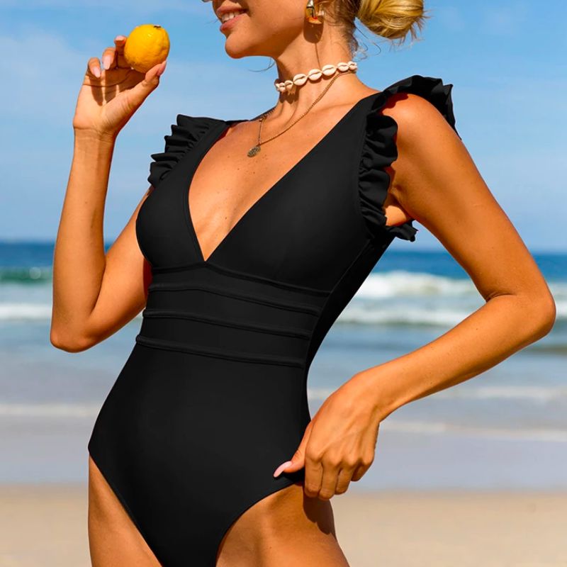Elegancki jednoczęściowy strój kąpielowy dla kobiet, z modnymi falbankami i dekoltem V. Modna plaża.