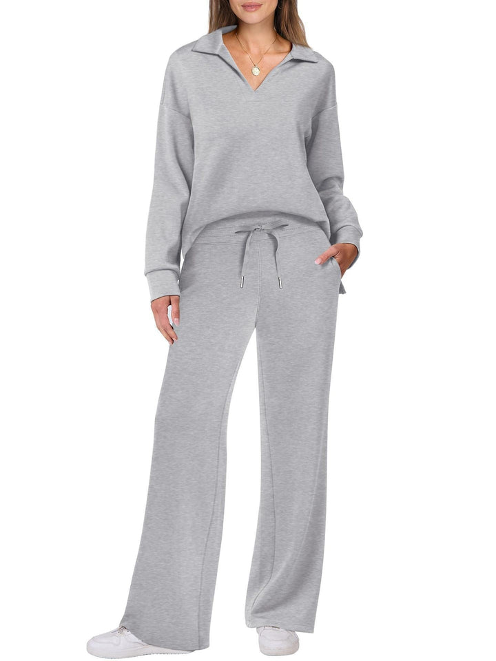 Grafitowy dres: bluza na zamek i luźne szerokie spodnie. Damski komplet casual.
