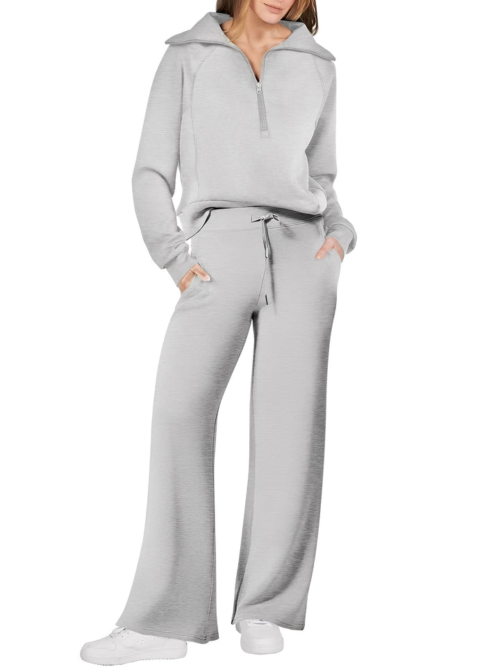 Modny damski komplet, sweter oraz spodnie dresowe, casualowy look, wygodny materiał.
