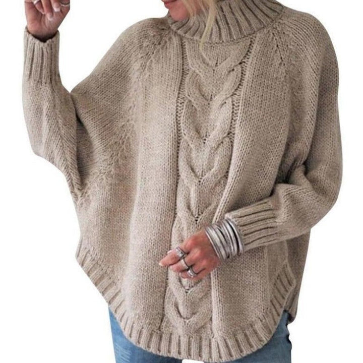 Damski sweter dziergany oversize z golfem i haftem, idealny na jesień i zimę.