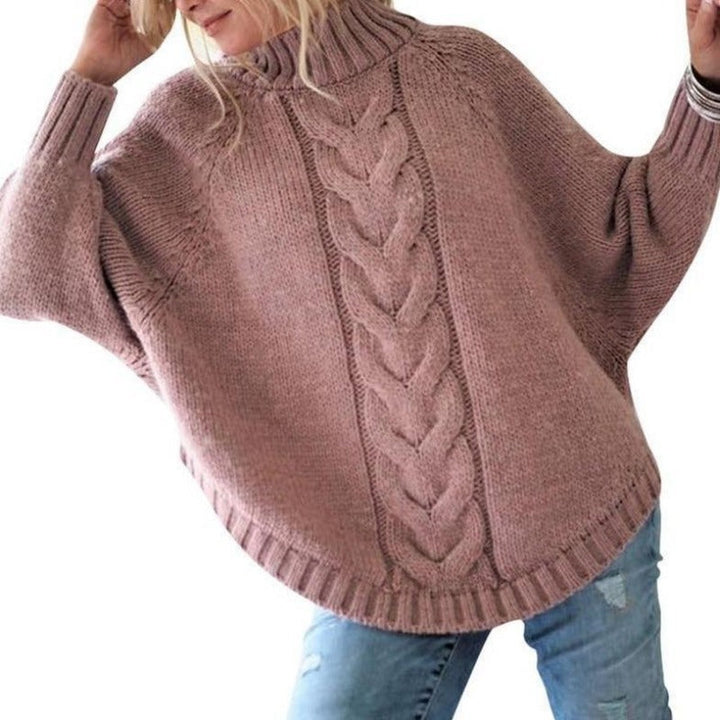 Wygodny sweter damski oversize z dzianiny z golfem, casualowy styl i ozdobny haft.