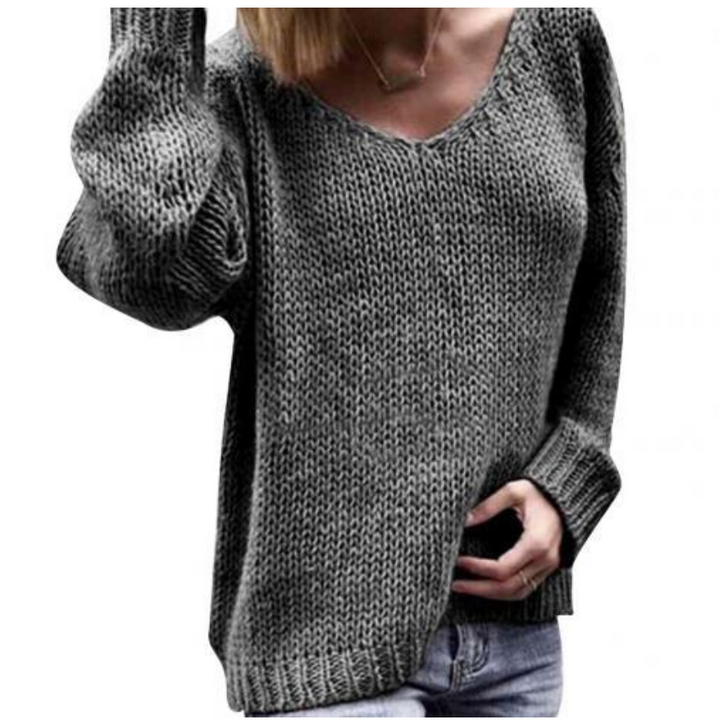Elegancki casualowy sweter damski z dekoltem V, dziergany. Ciepły i modny na jesienne i zimowe stylizacje.