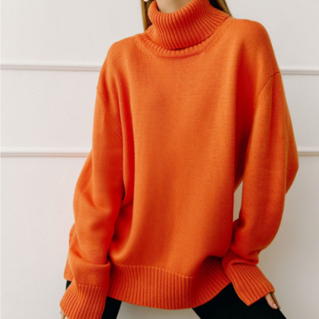 Stylowy sweter damski z wysokim golfem, luźny krój, modny wybór na chłodne dni.