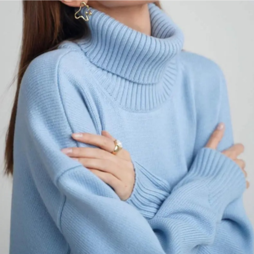 Zimowy sweter damski z golfem, w stylu oversize, idealny do warstwowych stylizacji.