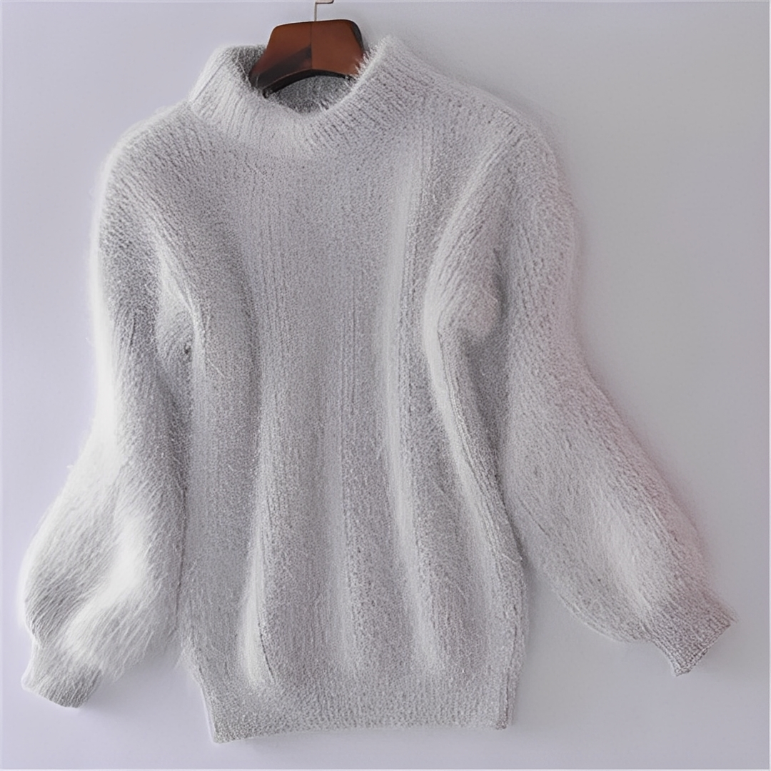 Modny sweter damski z golfem. Luźny krój doskonały do casualowych i eleganckich stylizacji na zimę.