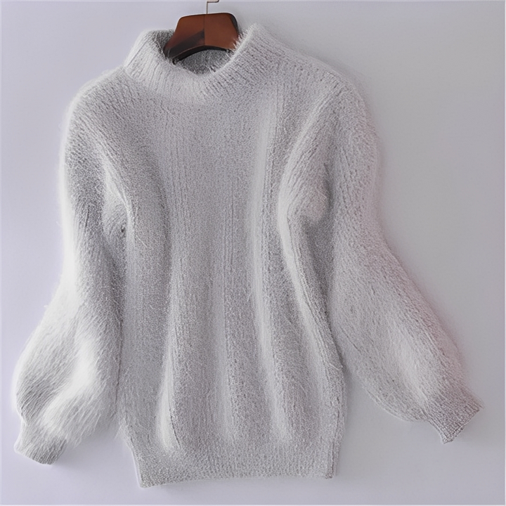 Modny sweter damski z golfem. Luźny krój doskonały do casualowych i eleganckich stylizacji na zimę.