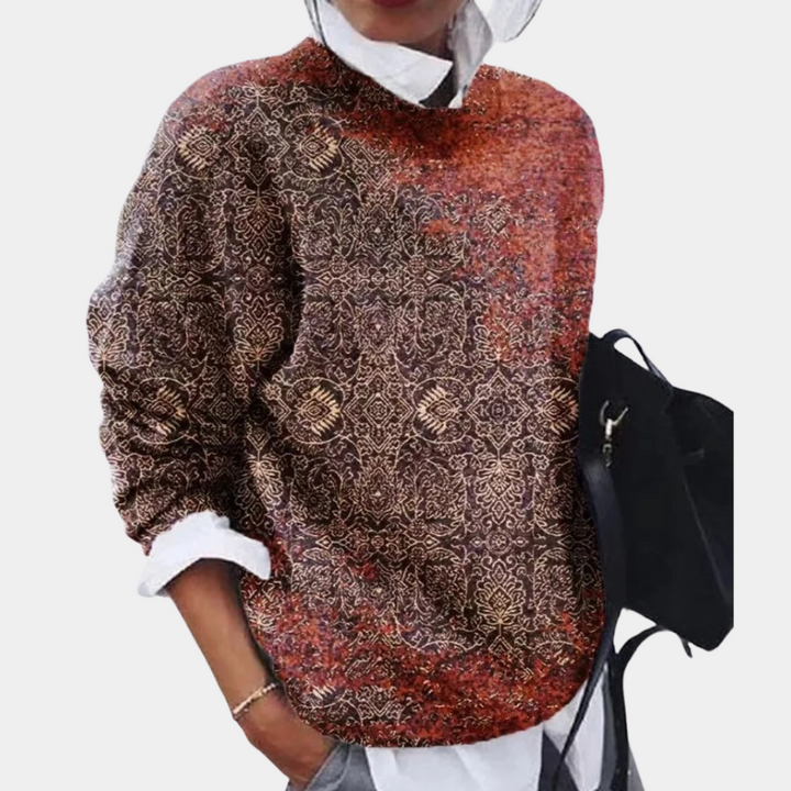 Wzorzysty sweter damski o luźnym kroju, komfortowy. Doskonały do jesiennych i zimowych stylizacji. Modna odzież.