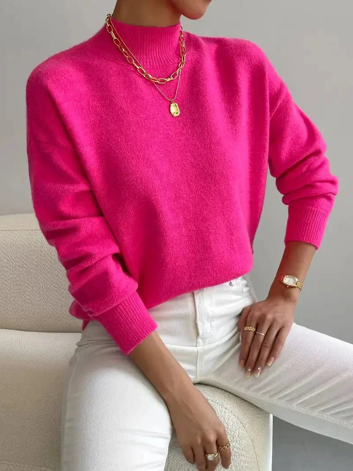 Stylowy sweter damski z okrągłym dekoltem. Dostępny w różnych kolorach, idealny do nowoczesnych stylizacji.