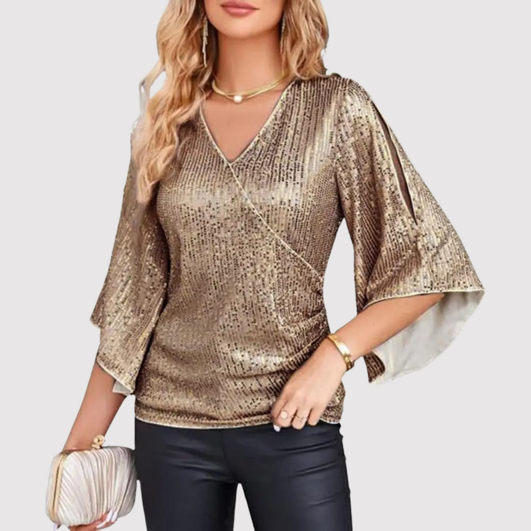 Elegancki top damski cekinowy z szerokimi, dzwonkowymi rękawami. Szykowna bluzka na imprezę lub wieczorowy look.