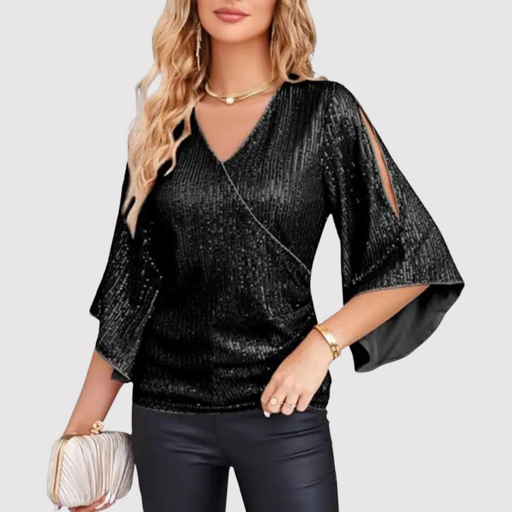 Modny top damski cekinowy z błyszczącym wykończeniem i stylowymi dzwonkowymi rękawami. Perfekcyjny na specjalne okazje.