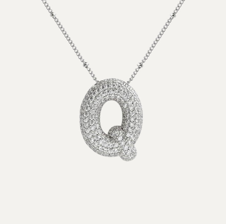 Złoty naszyjnik damski z błyszczącymi diamentami, personalizowana biżuteria.