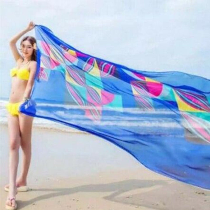 Długie pareo damskie w geometryczne wzory, modna chusta plażowa. Zwiewne, lekkie, idealne do letnich stylizacji.