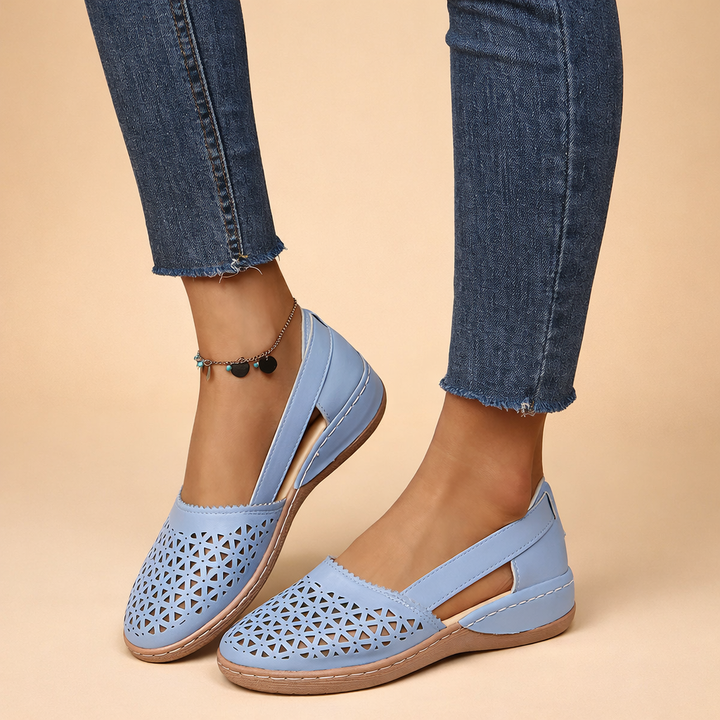Stylowe buty damskie Julian slip-on. Ażurowe wykończenie dla komfortu i modnego wyglądu.