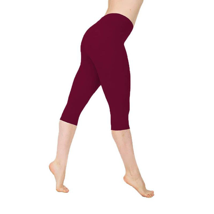 Stylowe damskie legginsy 3/4 z wysokim stanem. Gładkie, szare legginsy idealne do sportu i na co dzień.