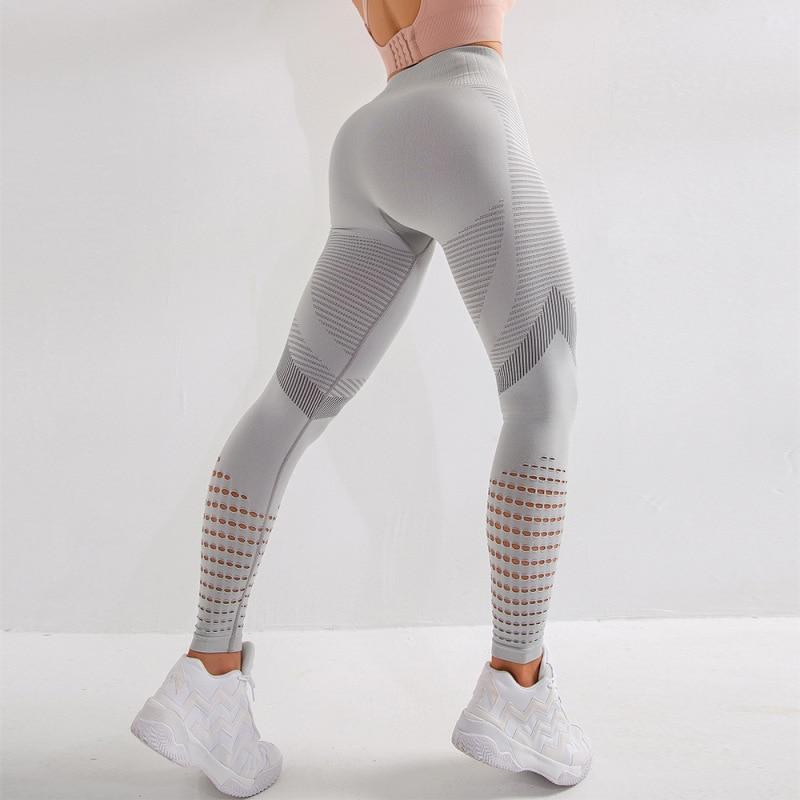 Damskie legginsy sportowe z wysokim stanem i modnymi wycięciami. Idealne do fitnessu i treningu.