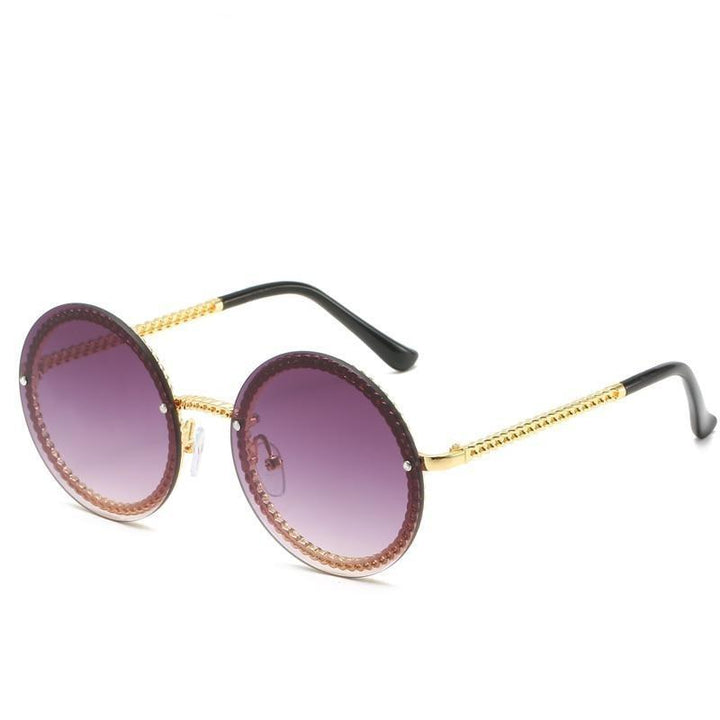 Damskie okulary przeciwsłoneczne okrągłe, must-have na lato, podkreślające styl, ochrona przed UV.
