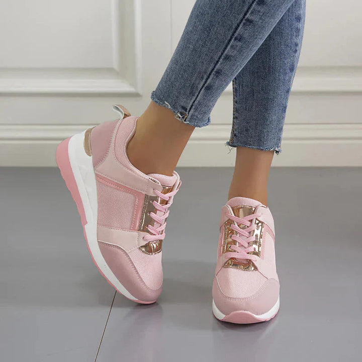 Różowe damskie sneakersy ortopedyczne na koturnie, zapewniające wygodę i modny wygląd przez cały dzień.
