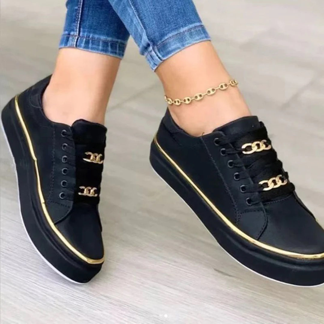 Damskie sneakersy z łańcuszkiem, eleganckie i wygodne. Obuwie zimowe ze złotymi detalami na co dzień.