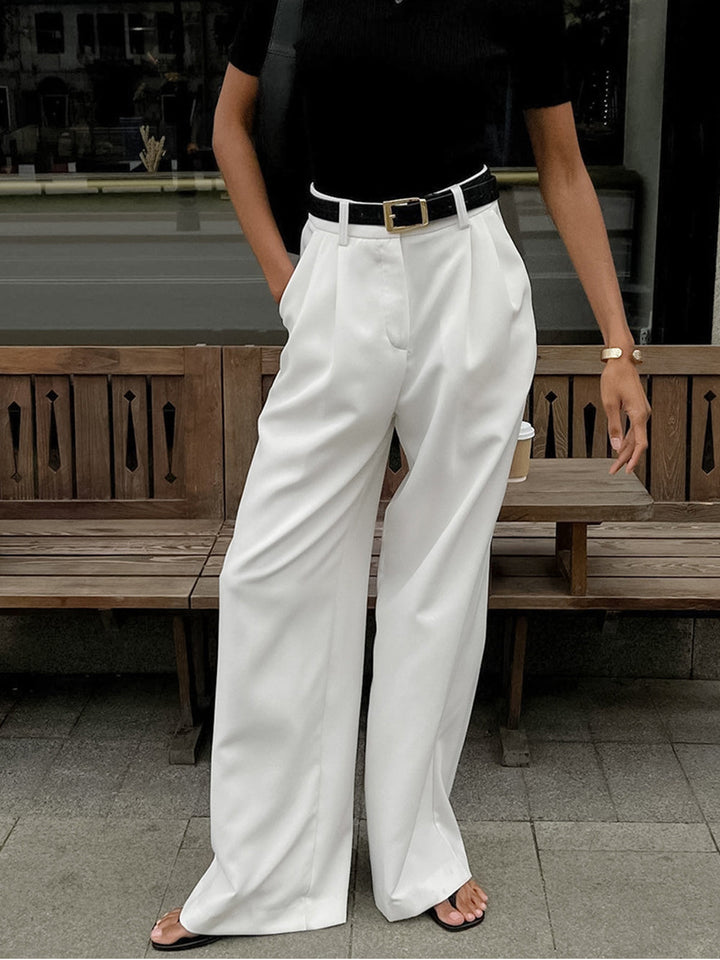 Modne damskie spodnie wide leg z wysokim stanem, zapewniające elegancję i komfort noszenia. Klasyczny design.