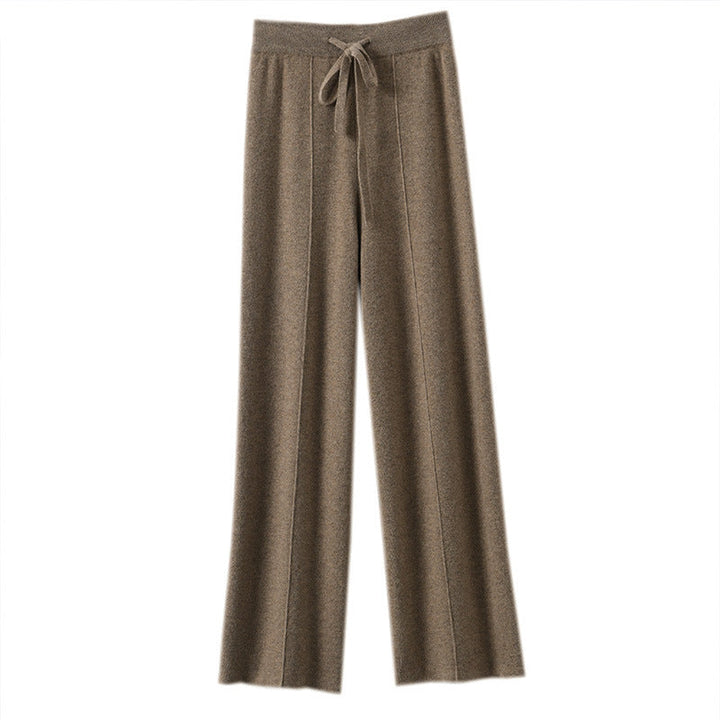Wygodne modne spodnie damskie, szerokie nogawki, wysoki stan, wiązany pas, styl casual.