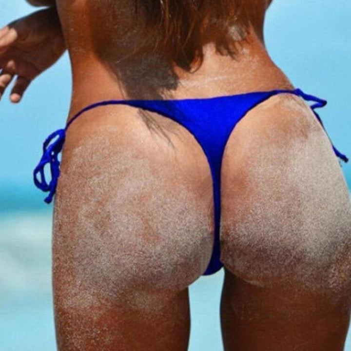 Regulowane stringi damskie z wiązaniem, zapewniające idealne dopasowanie. Wygodne bikini z poliestru na lato.