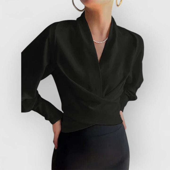 Szykowna bluzka damska z bufkami, idealna do pracy. Elegancka i wygodna, doskonała na jesień.