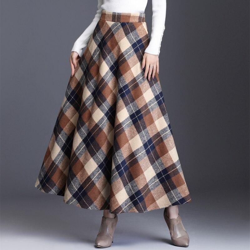 Damska spódnica maxi w kracie, z kieszeniami, rozkloszowany krój, zapewnia wygodę i modny, elegancki wygląd.