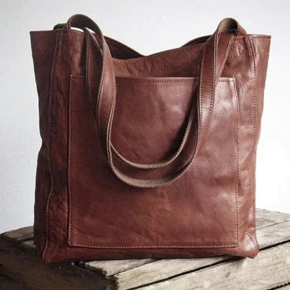 Duża, funkcjonalna torba damska maxi ze skóry naturalnej, typu shopper, idealna do noszenia na ramieniu.