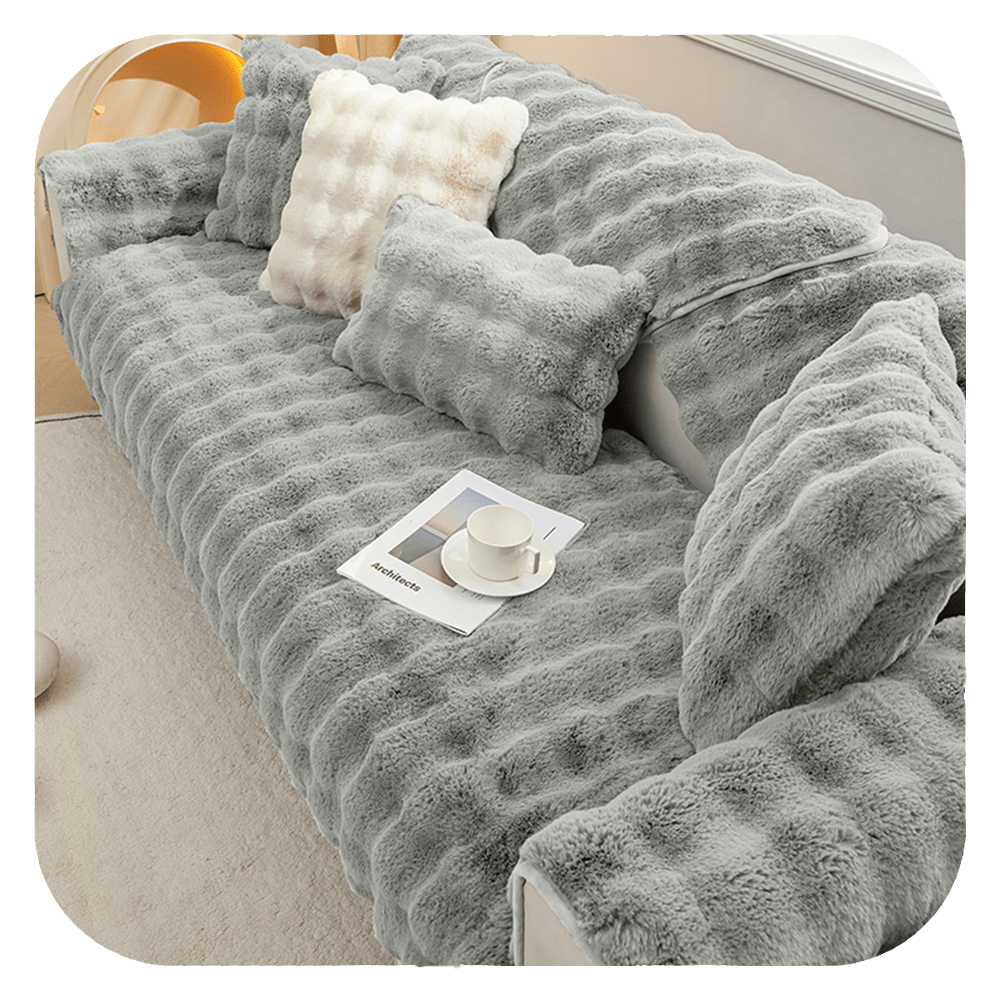Antypoślizgowa narzuta na sofę chroniąca meble przed zużyciem, łatwa w czyszczeniu.